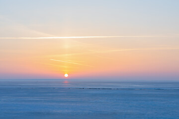 Beautiful winter landscape with a sunset in the north