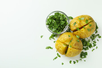 Baked potato with parsley on white background