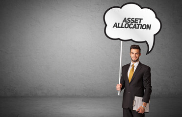 business person in casual holding road sign