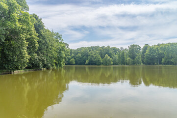 Fototapeta na wymiar Potulicki pond in the Potulicki park at summer time in Pruszkow Poland.