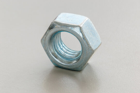 Silver metal nut. Nut is a type of fastener with a threaded hole.