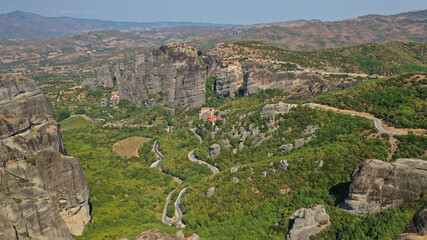 Fototapeta na wymiar Aerial drone photo of iconic Monastery of Rousanou at Meteora monasteries complex of immense natural pillars and hill-like rounded stones, an Unesco World Heritage site, Thessaly, Greece
