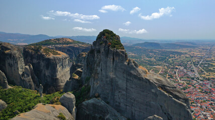 Fototapeta na wymiar Aerial drone photo of iconic Meteora rock formation complex of immense natural pillars and hill-like rounded stones, an Unesco World Heritage site, Thessaly, Greece