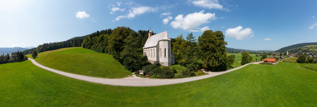 Austria, Upper Austria, Oberwang, Drone panorama of Saint Conrad Church and surrounding landscape in summer