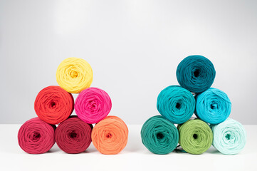 Rows of multicolored cotton yarn. The assortment of the store for needlework.