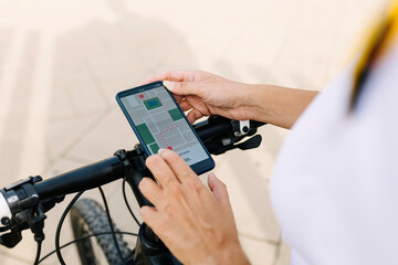Delivery woman checking map on smart phone
