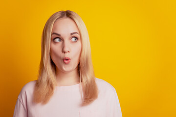 Portrait of shocked surprised lady open mouth look empty space on yellow background - obrazy, fototapety, plakaty