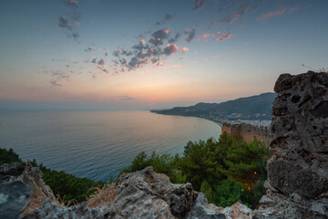 Naklejka na ściany i meble Beautiful sunset at the Alanya castle by the Mediterranean Sea. Turkey