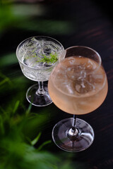 Gin cocktails on a wooden table in a restaurant near window