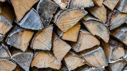 Fototapeta premium stack of firewood closeup background full frame