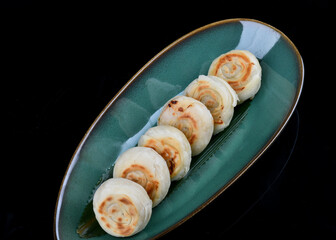 A row of small round cakes