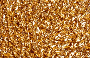 Abstract background shimmering texture metallic glitter foil. Crumpled foil as an unusual background.