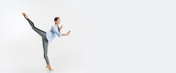 Portrait of young business woman, worker making video call isolated over white background