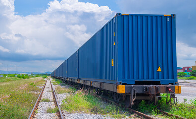 Train with container cargo boxes at railway station transport logistic distribution goods is industry business concept.