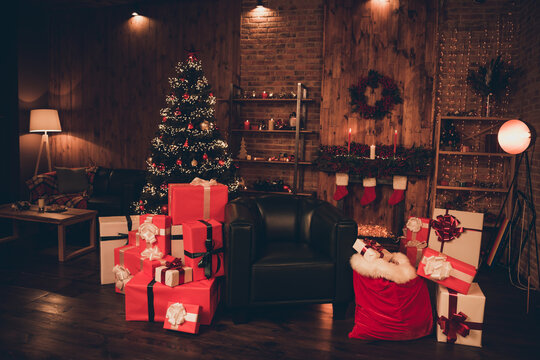 Photo of Santa's living room pile stack gifts eve day advent tradition at home loft wooden brick industrial interior indoors