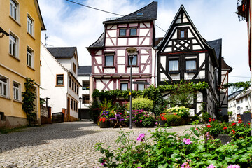Half-timbered houses with blooming flowers in foreground in the old town of Montabaur, Germany