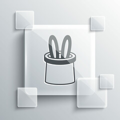 Grey Magician hat and rabbit ears icon isolated on grey background. Magic trick. Mystery entertainment concept. Square glass panels. Vector