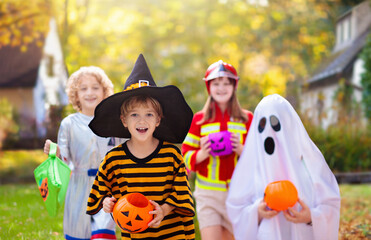 Kids trick or treat. Halloween fun for children.