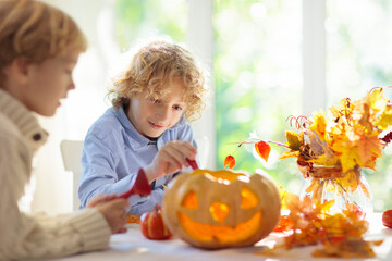 Fototapeta na wymiar Family carving pumpkin for Halloween