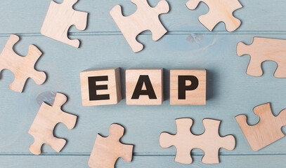 Blank puzzles and wooden cubes with the text EAP Employee Assistance Program