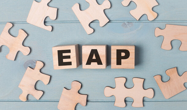 Blank Puzzles And Wooden Cubes With The Text EAP Employee Assistance Program