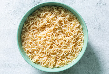 instant noodles,Concept of tasty eating with bowl of noodles on gray background