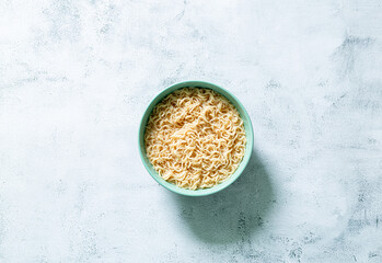 instant noodles,Concept of tasty eating with bowl of noodles on gray background