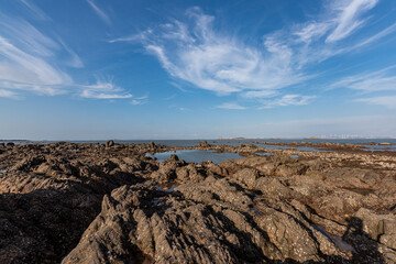 Yellow reef and sea under the blue sky