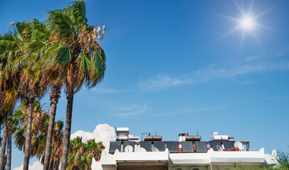 Аttic of the house with installed hot water heating systems and television antennas.
