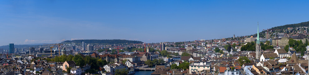 Naklejka na ściany i meble Aerial wide angle panorama view over City of Zurich on a beautiful late summer day. Photo taken September 8th, 2021, Zurich, Switzerland.