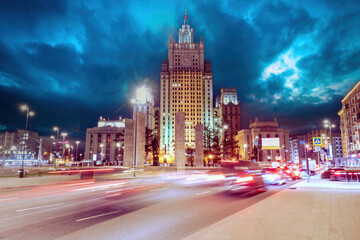 Fototapeta na wymiar Evening Moscow. Russia. Buildings of Ministry of Foreign Affairs. Moscow in winter evening. Moscow roads with effect of speed. Russian architecture. Sights of Russia. Russian tourism.