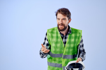 male worker in a white helmet blueprints Professional studio industry