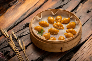 Fototapeta premium Traditional Chinese banquet dishes, steamed dumplings with corn skin