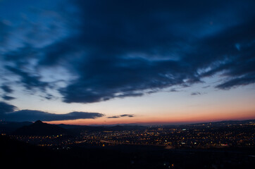 Fototapeta premium view of the lights of a night city, sunset