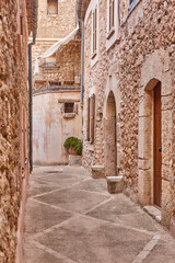 Fototapeta na wymiar Picturesque stepped stone street in Mallorca island. Bunyola village. Spain