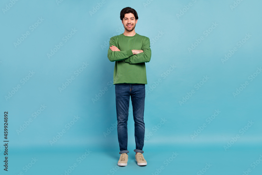 Sticker Full body photo of smiling cool businessman with folded hands modern freelancer isolated on blue color background