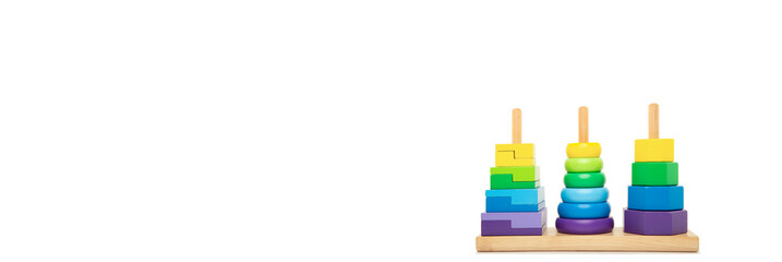 Bright coloured stacking toy for toddlers front view. Concept of Montessori kindergarten, Waldorf kindergarted, Early Childhood Eduation, Special needs education.