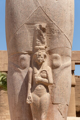 The statue of Ramses II with his daughter Merit-Amon in the temple of Amun-RA in Karnak, Luxor,...
