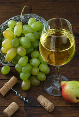 Wine in glass and fruits on the table