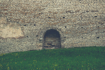The fortress wall of the historical and architectural complex in the old city of Pskov preserved from the 12th century, Russia.