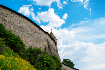 The fortress wall of the historical and architectural complex in the old city of Pskov preserved...
