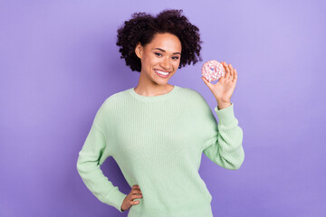 Photo of young cheerful afro american woman hold hand waist donut smile addicted isolated on violet color background