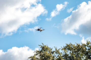 Fototapeta na wymiar Drone quadrocopter with digital camera and sensors high flying