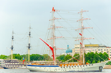 An old sailboat with scarlet sails in the Neva River in St. Petersburg.