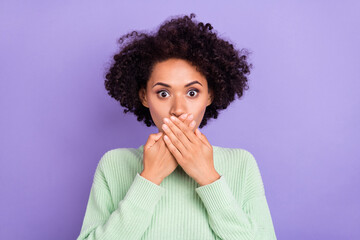 Photo of young amazed shocked afro american woman cover face mouth hands isolated on violet color background