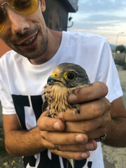 portrait of a man holding a bird
