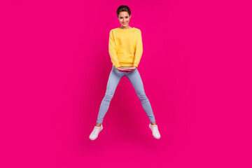Fototapeta na wymiar Full length body size view of attractive cheerful cute girl jumping posing isolated over bright pink color background