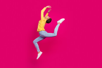Fototapeta na wymiar Full length body size view of attractive sportive girl jumping dancing moving isolated over bright pink color background