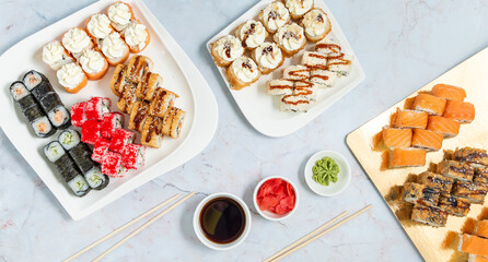 set sushi rolls on a white plates on a white background