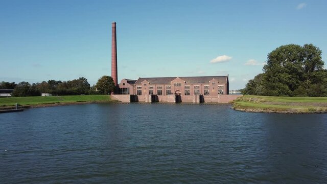 The Woudagemaal is the largest steam pumping station ever built in the world. Located in Lemmer in the Netherlands, aerial forwards